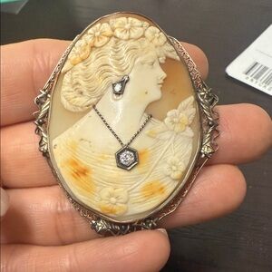 Elegant Cameo Brooch with solid gold rims and diamonds with hand created ivory